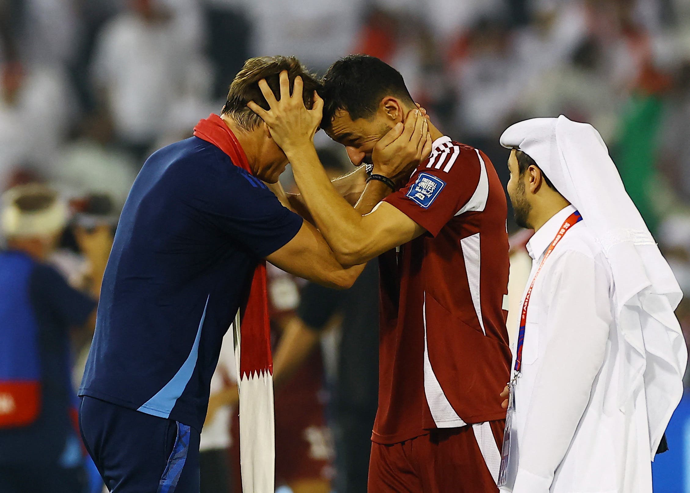 Soccer Football - FIFA World Cup - AFC Qualifiers - Group A - Qatar v United Arab Emirates - Jassim Bin Hamad Stadium, Doha, Qatar - October 14, 2025 Qatar coach Julen Lopetegui celebrates with Boualem Khoukhi after qualifying for the FIFA World Cup REUTERS/Ibraheem Al Omari