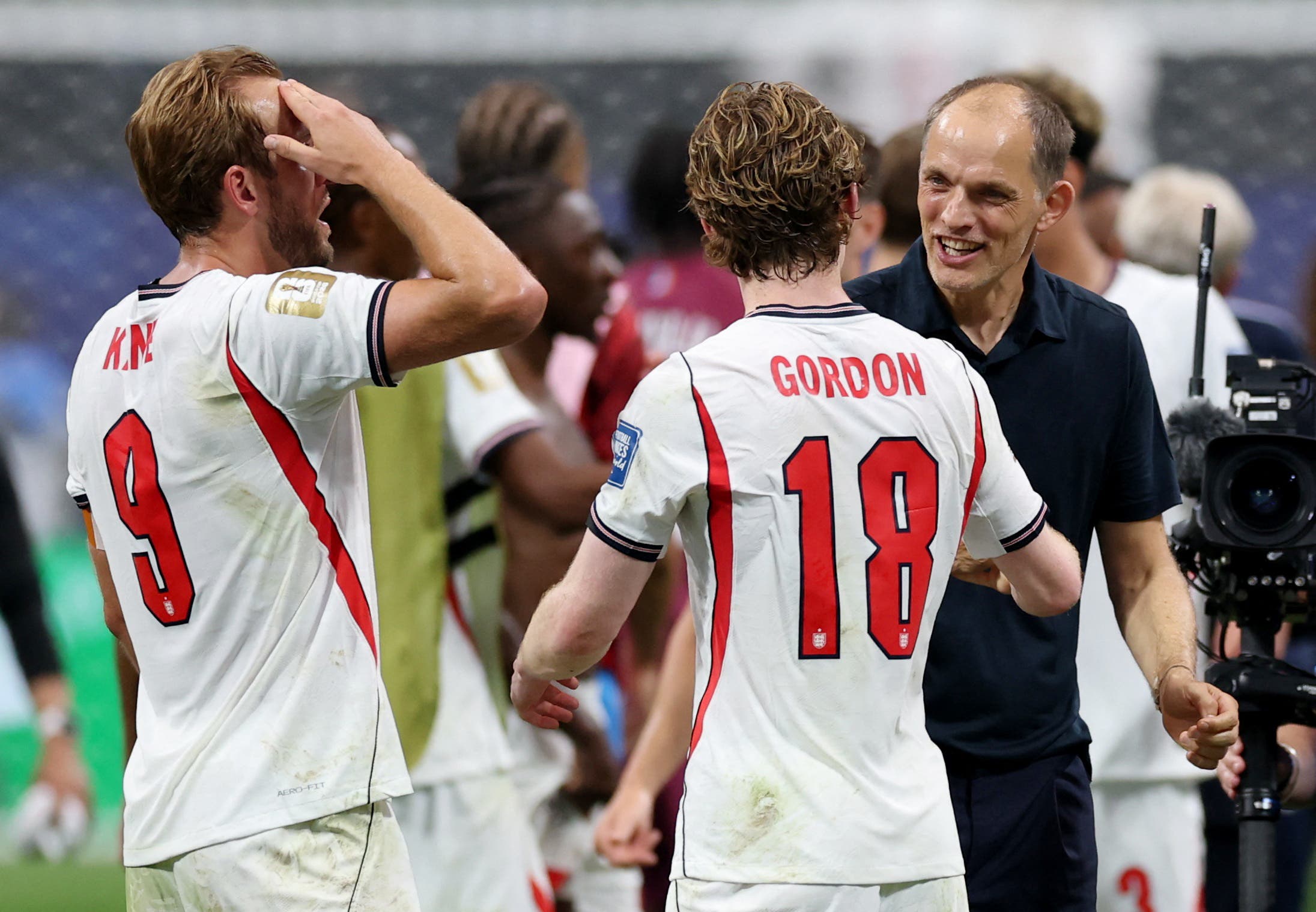 Soccer Football - FIFA World Cup 2026 - Round of 32 - England v DR Congo - Atlanta Stadium, Atlanta, Georgia, U.S. - July 1, 2026 England manager Thomas Tuchel, Anthony Gordon and Harry Kane celebrate after the match as England qualify for the Round of 16 stage of the World Cup REUTERS/Paul Childs

