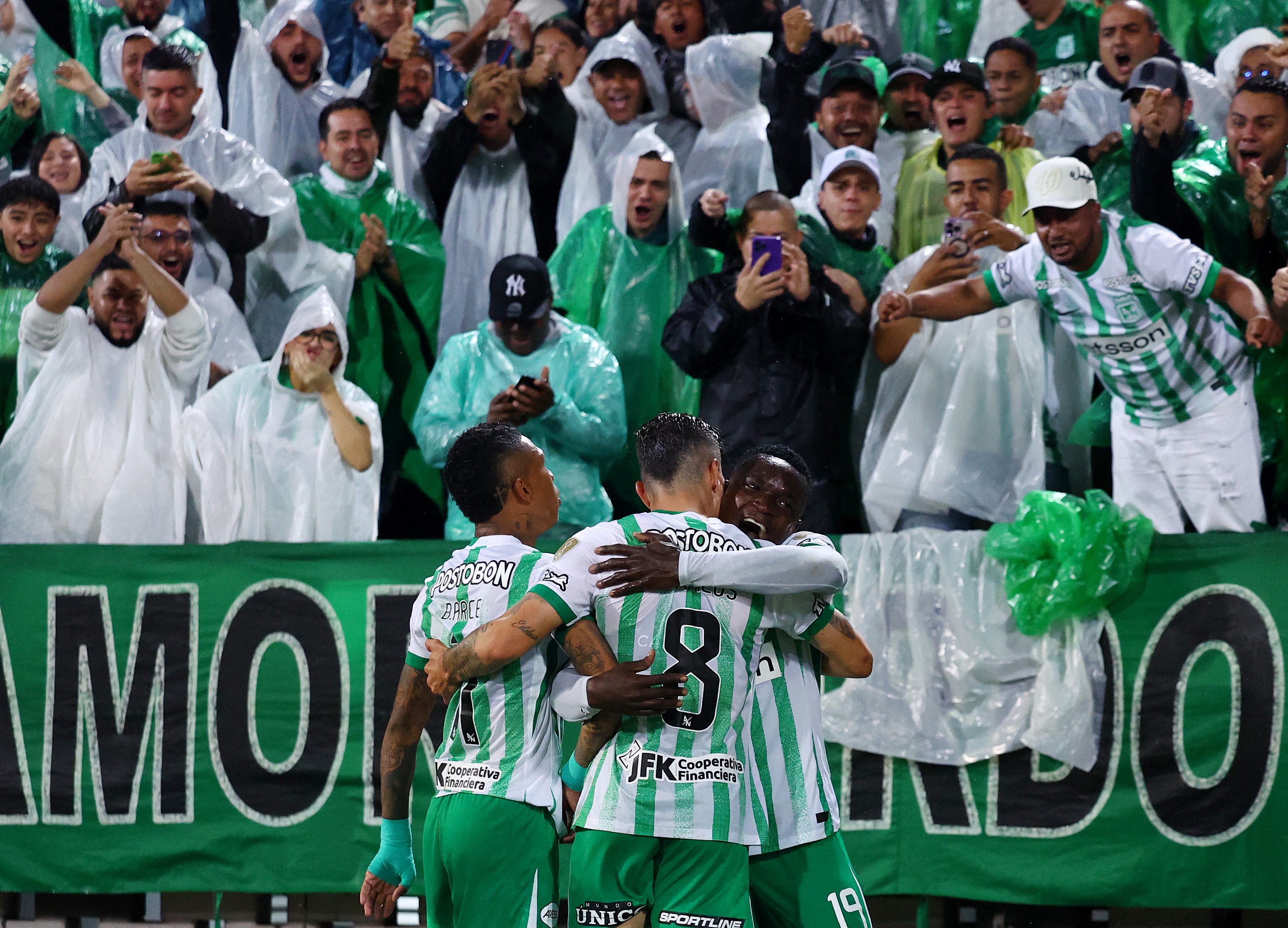  Atletico Nacional's Kevin Viveros celebrates scoring their first goal with Mateus Uribe and Billy Arce