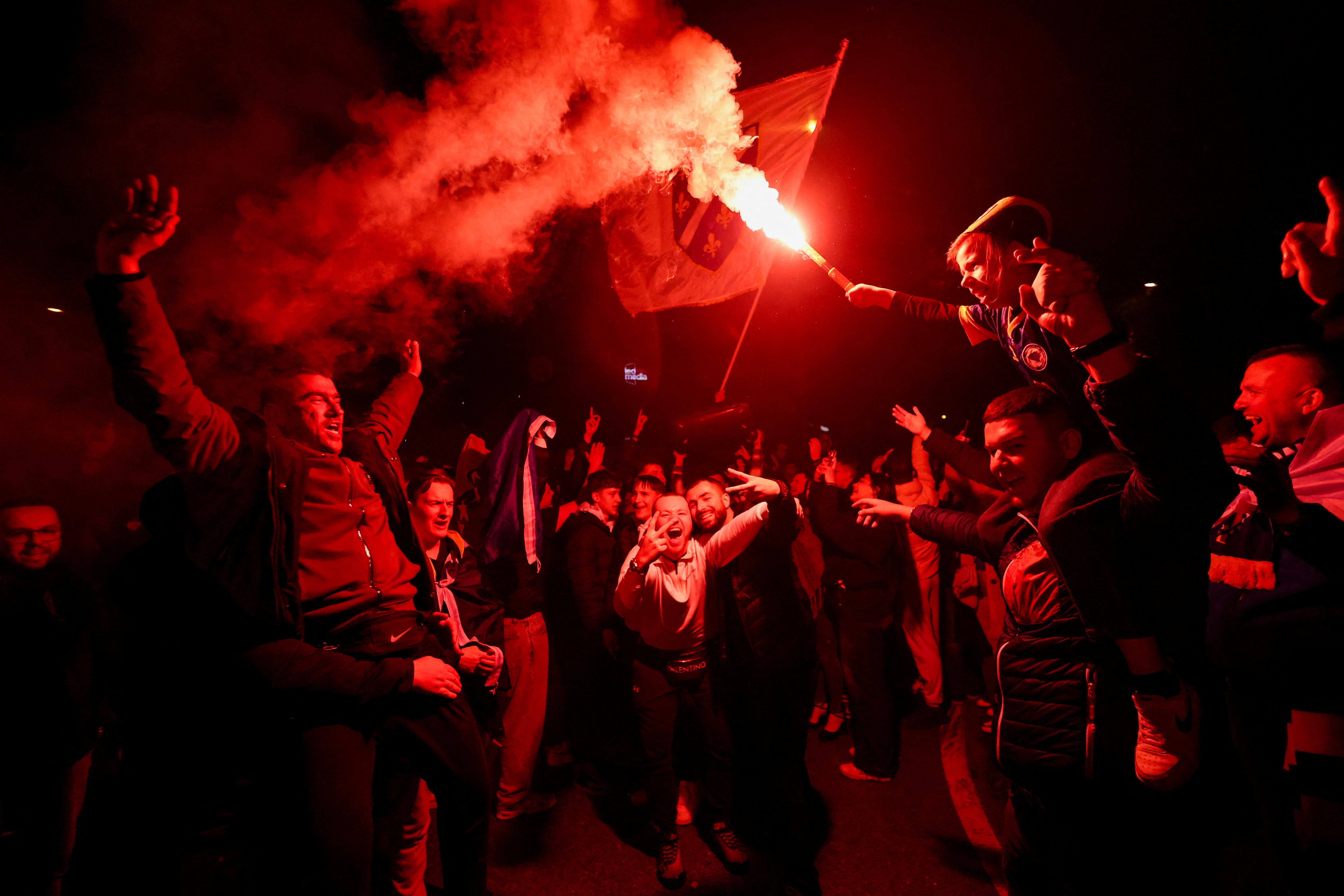 Bosnian supporters celebrate after Bosnia and Herzegovina beat Italy on penalties in a FIFA World Cup 2026 European playoff final, in Zenica, Bosnia and Herzegovina, April 1, 2026. REUTERS/Amel Emric