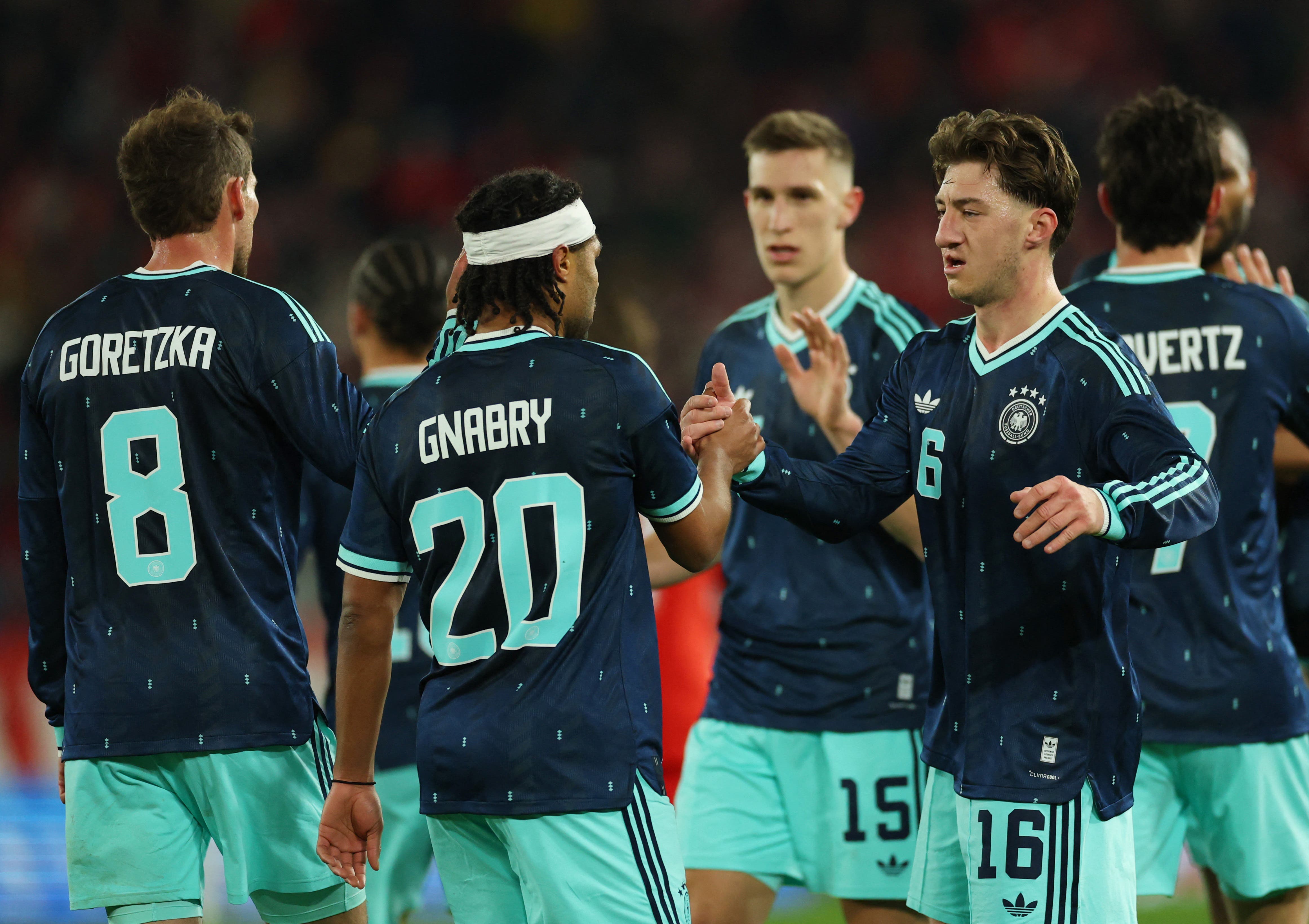 Soccer Football - International Friendly - Switzerland v Germany - St. Jakob-Park, Basel, Switzerland - March 27, 2026 Germany's Serge Gnabry celebrates scoring their second goal with Angelo Stiller REUTERS/Denis Balibouse