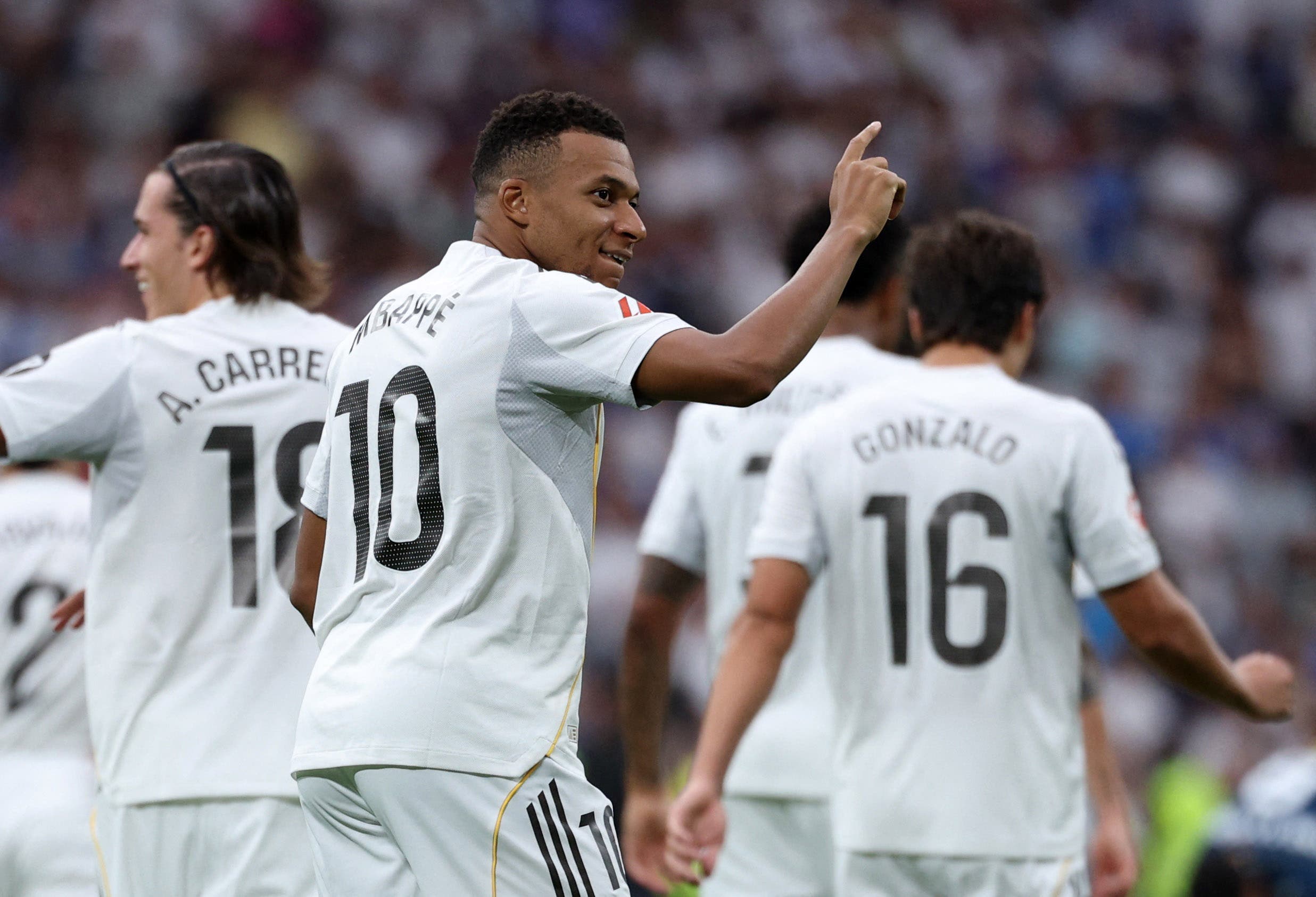 Kylian Mbappé celebrates a goal during a match with Real Madrid.