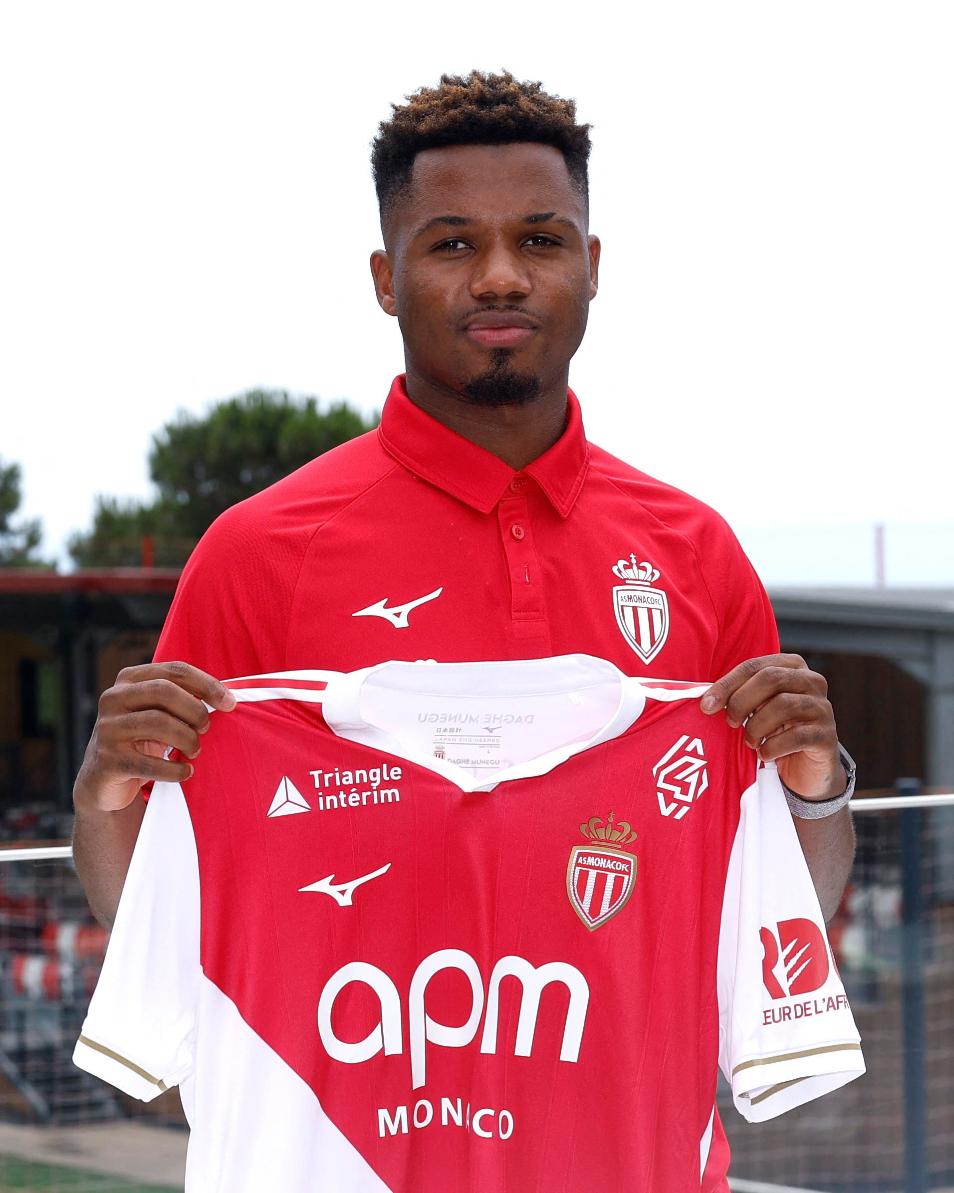 Soccer Football - AS Monaco Press Conference - La Turbie, France - July 3, 2025 AS Monaco new signing Ansu Fati poses with his shirt during the unveiling REUTERS/Manon Cruz
