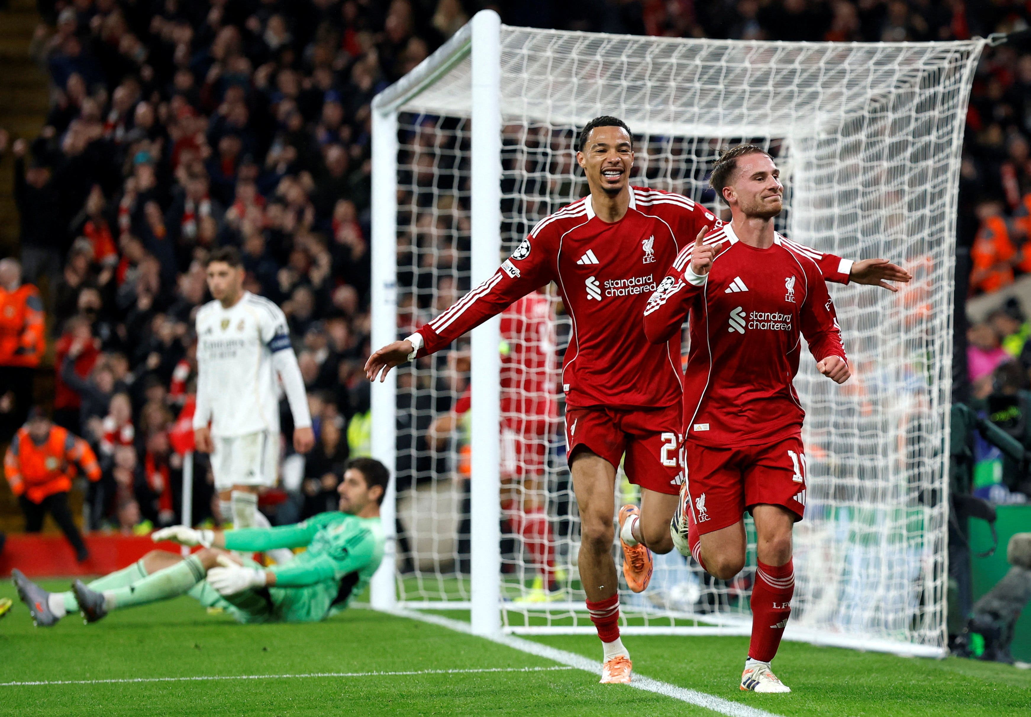 Soccer Football - UEFA Champions League - Liverpool v Real Madrid - Anfield, Liverpool, Britain - November 4, 2025 Liverpool's Alexis Mac Allister celebrates scoring their first goal with Hugo Ekitike Action Images via Reuters/Jason Cairnduff TPX IMAGES OF THE DAY