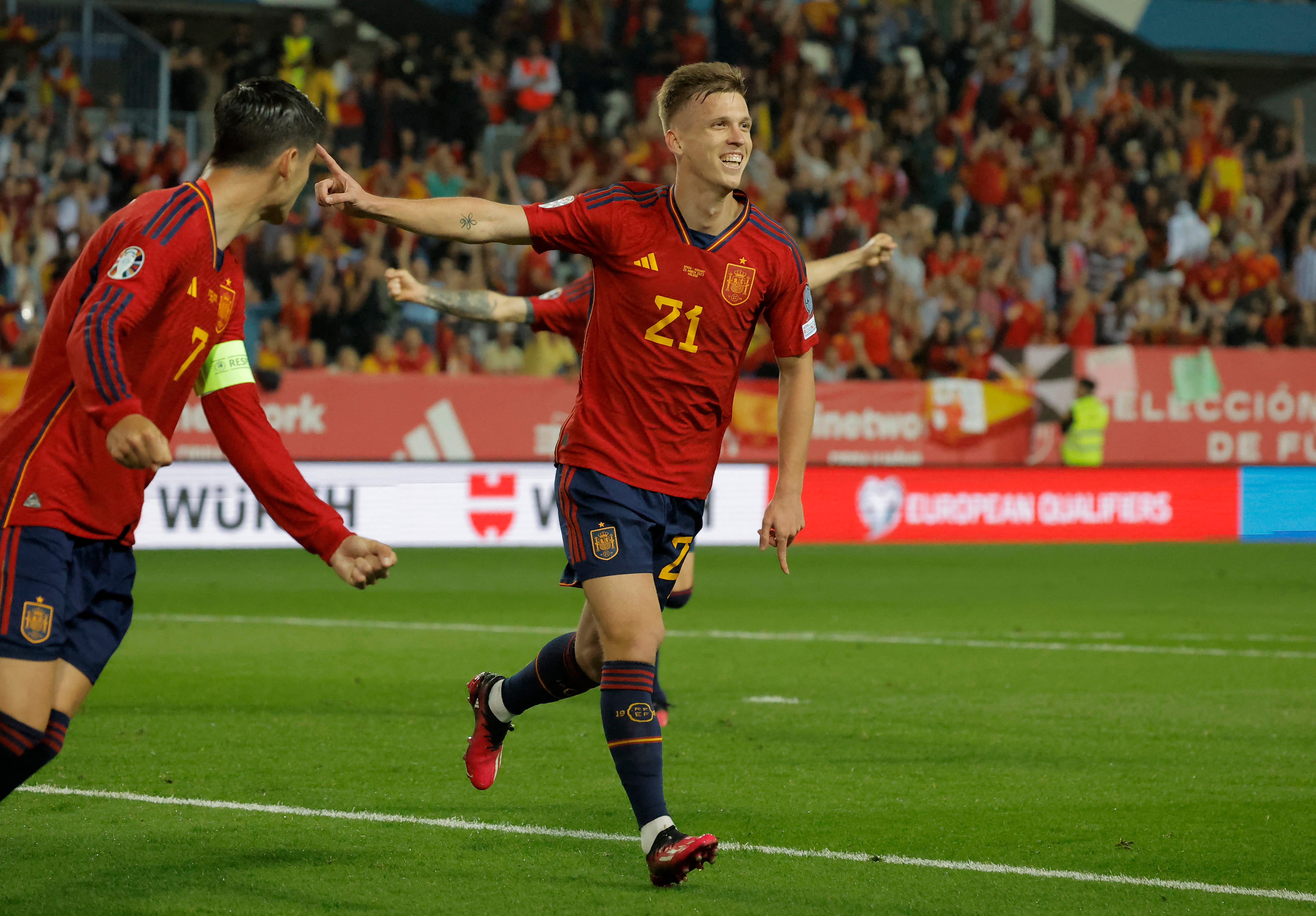 Soccer Football - UEFA Euro 2024 Qualifier - Group A - Spain v Norway - La Rosaleda Stadium, Malaga, Spain - March 25, 2023 Spain's Dani Olmo celebrates scoring their first goal with Alvaro Morata REUTERS/Jon Nazca