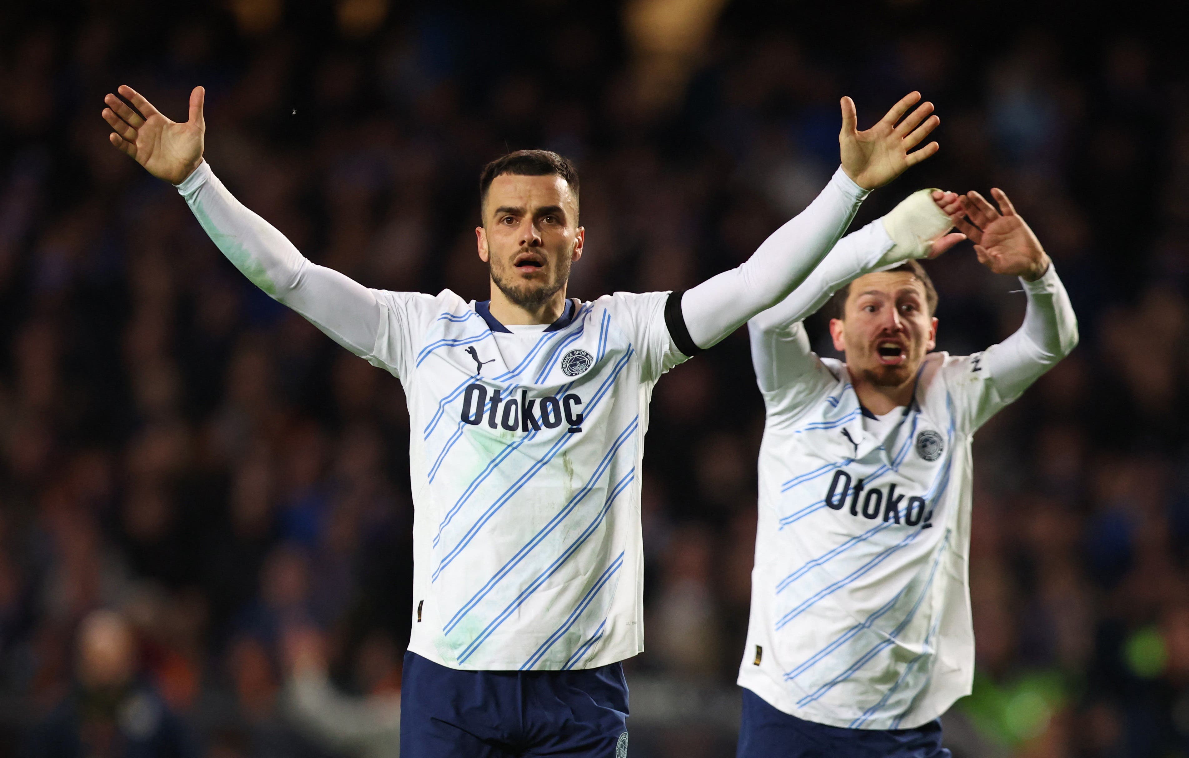 Soccer Football - Europa League - Round of 16 - Second Leg - Rangers v Fenerbahce - Ibrox, Glasgow, Scotland, Britain - March 13, 2025 Fenerbahce's Dusan Tadic and Mert Yandas react Action Images via Reuters/Craig Brough
