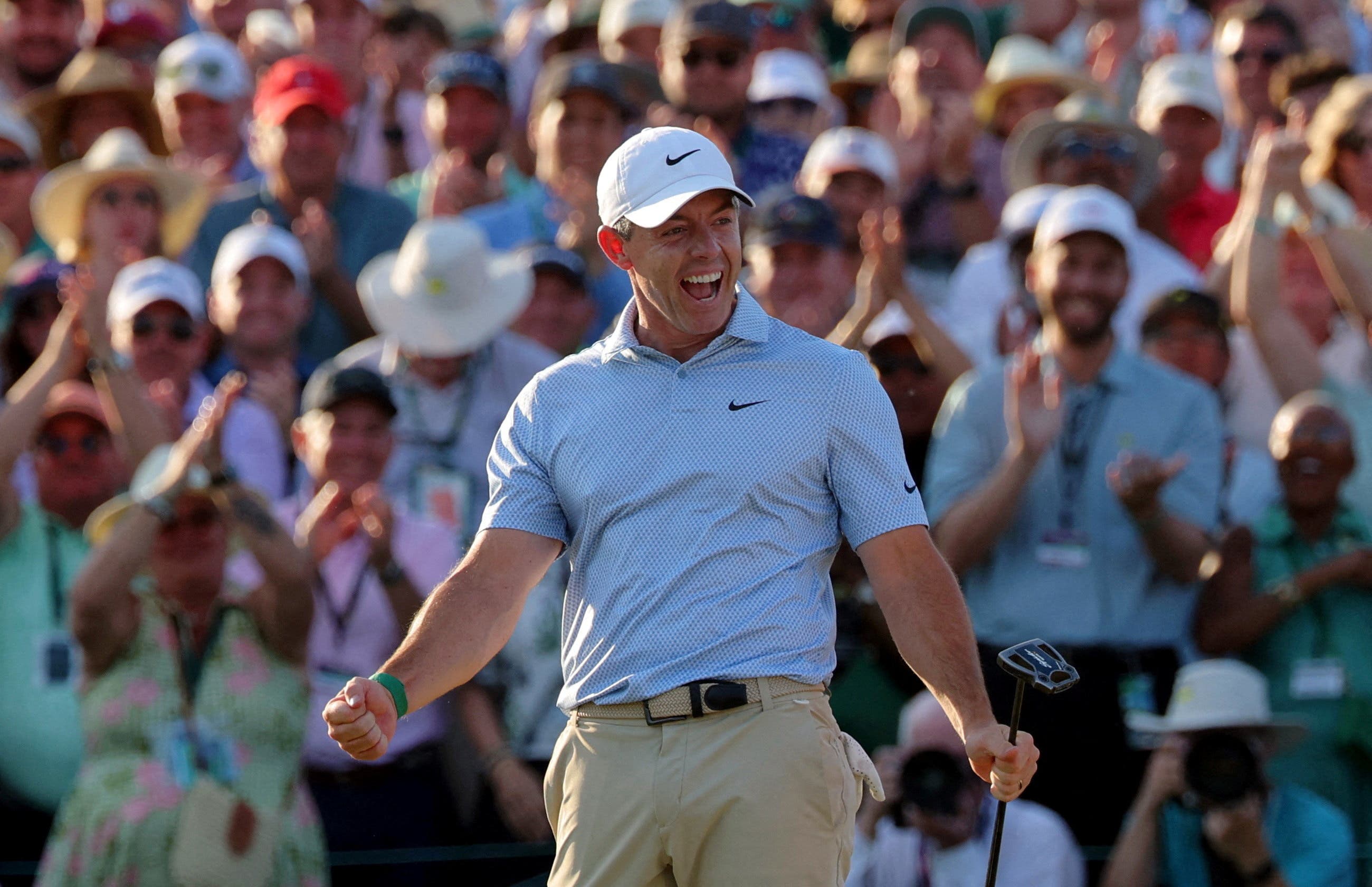 Golf - The Masters - Augusta National Golf Club, Augusta, Georgia, U.S. - April 12, 2026 Northern Ireland's Rory McIlroy celebrates on the green on the 18th hole after winning The Masters REUTERS/Mike Segar TPX IMAGES OF THE DAY

