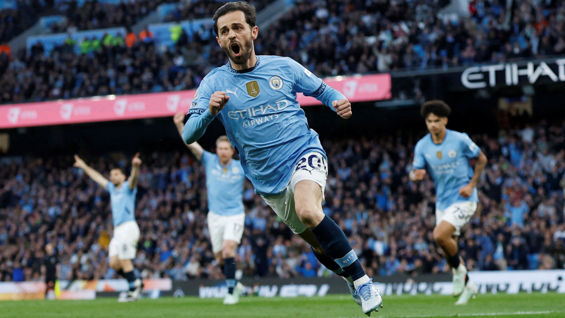 Bernardo Silva celebrates a goal during a match with Manchester City.