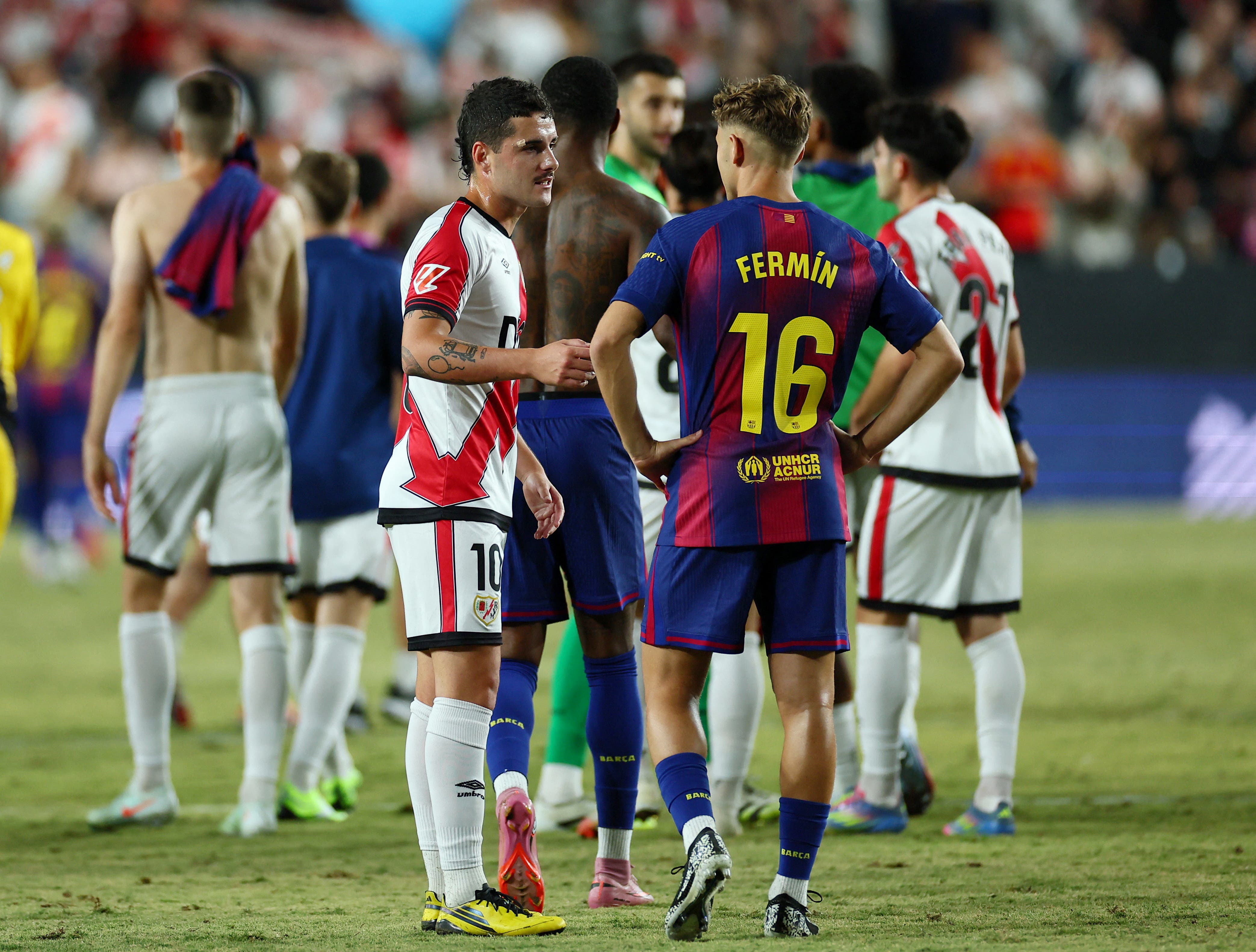 Players of Rayo Vallecano and Barcelona after the final blow of their match in LaLiga.