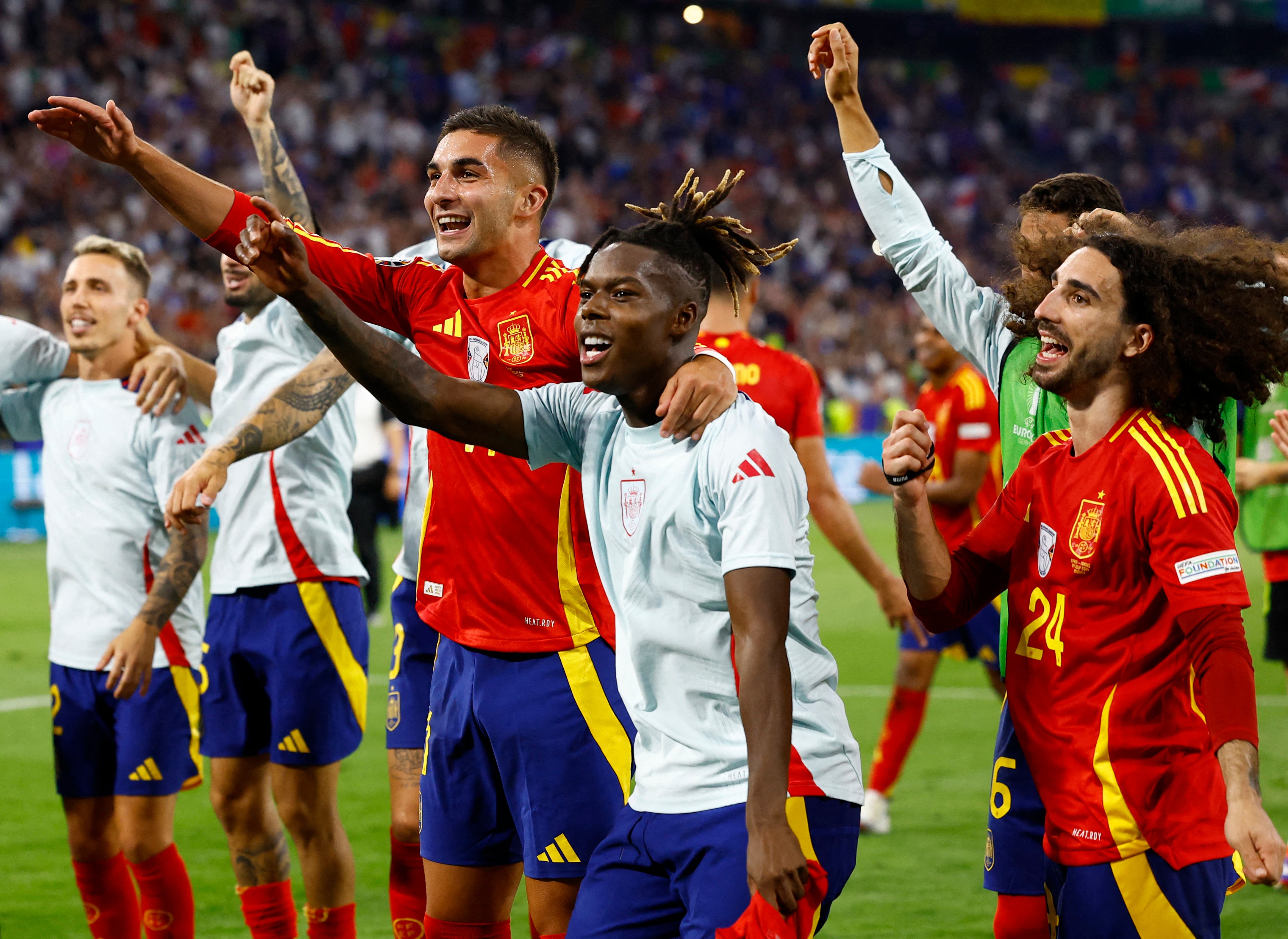 Spain's Ferran Torres, Nico Williams and Marc Cucurella celebrate after the match
