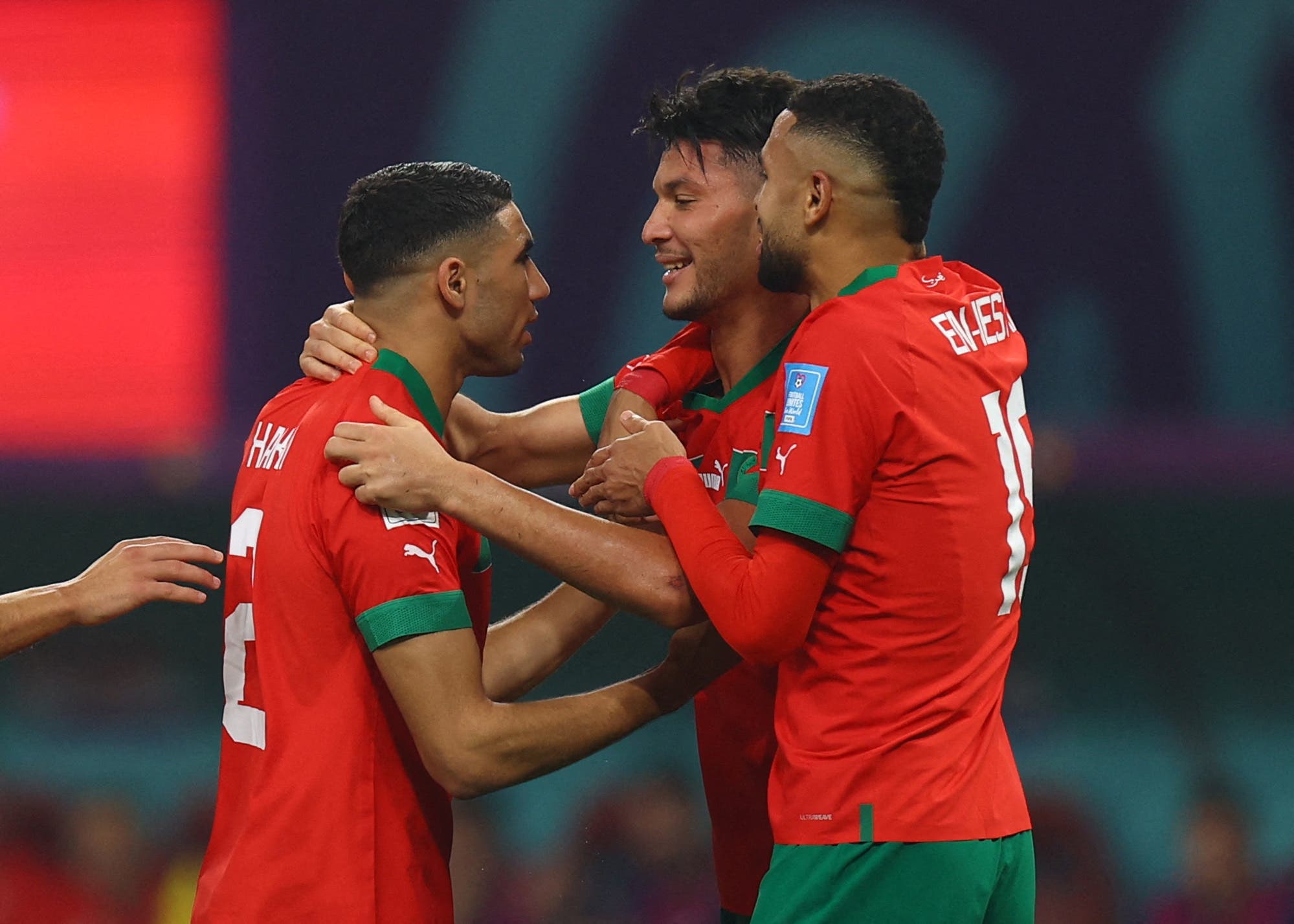 Soccer Football - FIFA World Cup Qatar 2022 - Third-Place Playoff - Croatia v Morocco - Khalifa International Stadium, Doha, Qatar - December 17, 2022 Morocco's Achraf Dari celebrates scoring their first goal with Achraf Hakimi and Youssef En-Nesyri REUTERS/Molly Darlington