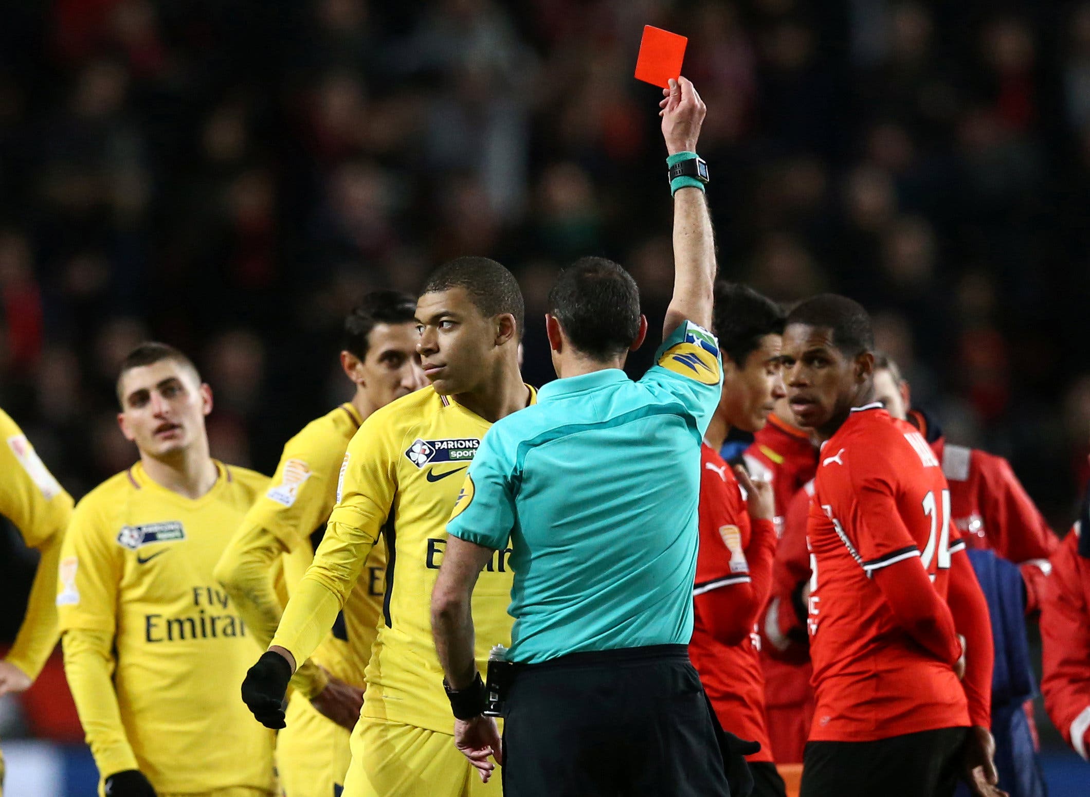Paris Saint-Germain’s Kylian Mbappe is shown a red card