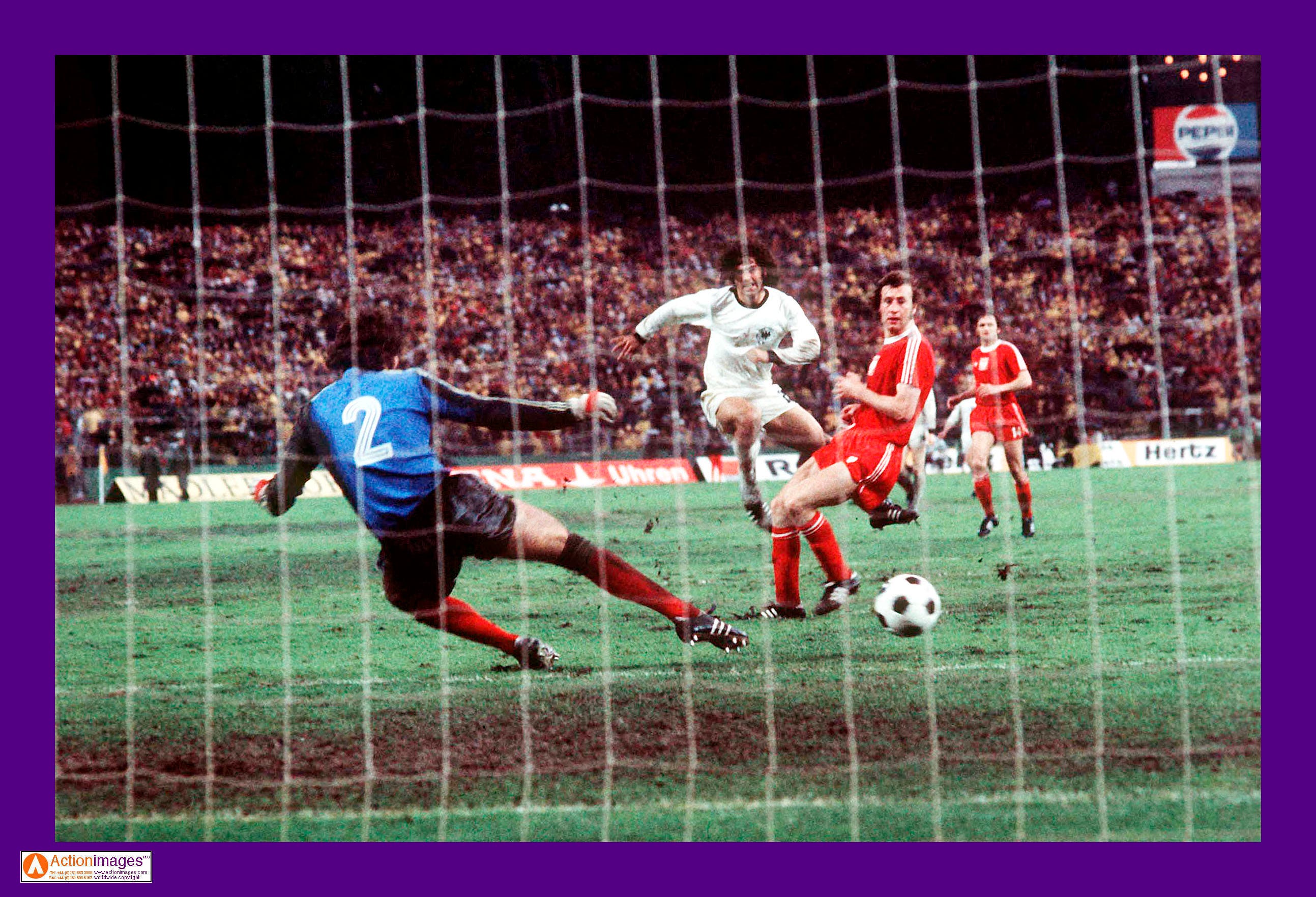 Football - 1974 FIFA World Cup - Second Phase Group 2 - West Germany v Poland - Waldstadion, Frankfurt - 3/7/74 Gerd Muller of West Germany beats Poland goalkeeper Jan Tomaszewski to score Mandatory Credit: Action Image