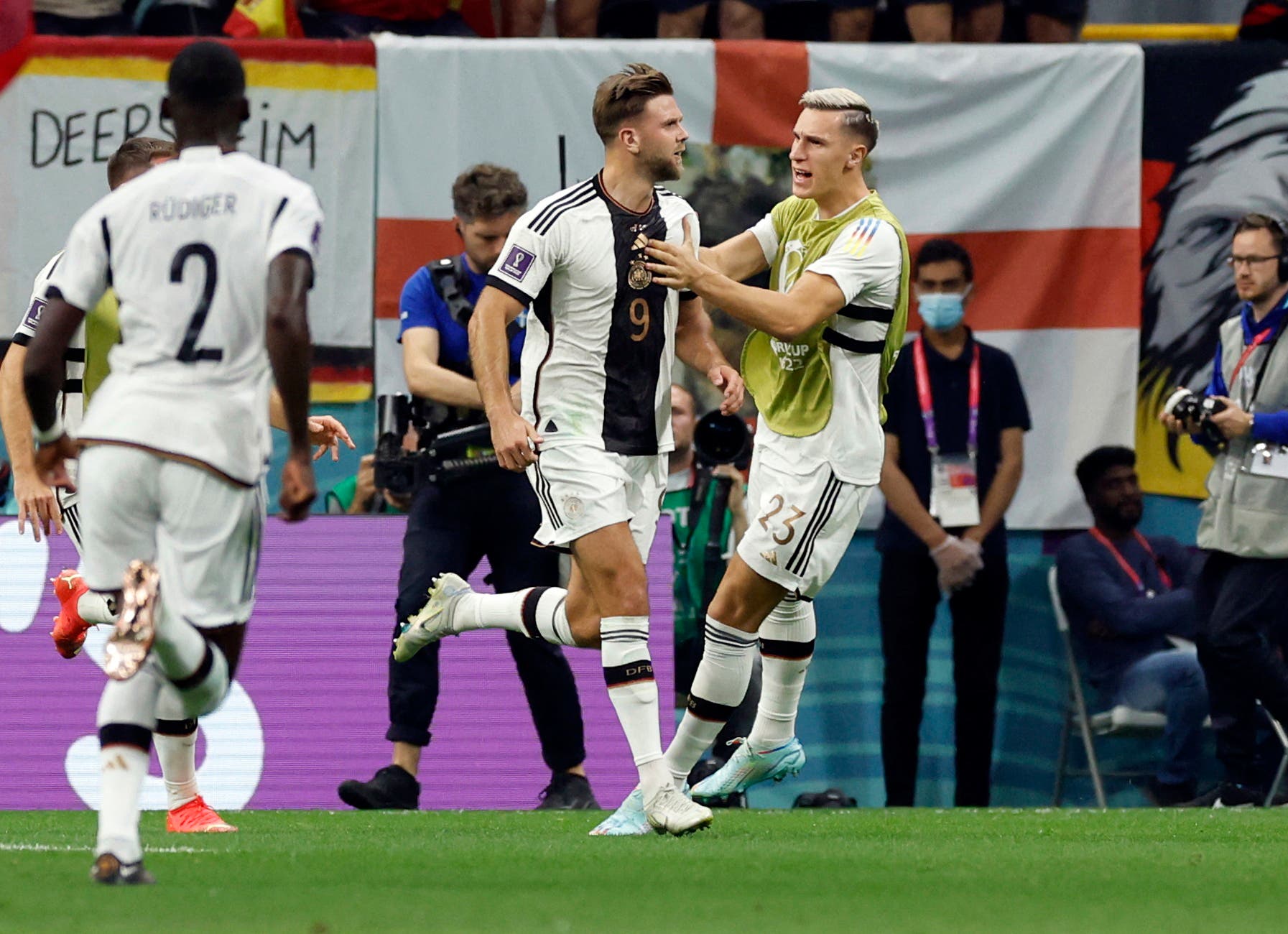Soccer Football - FIFA World Cup Qatar 2022 - Group E - Spain v Germany - Al Bayt Stadium, Al Khor, Qatar - November 27, 2022 Germany's Niclas Fullkrug celebrates scoring their first goal with Nico Schlotterbeck REUTERS/Albert Gea