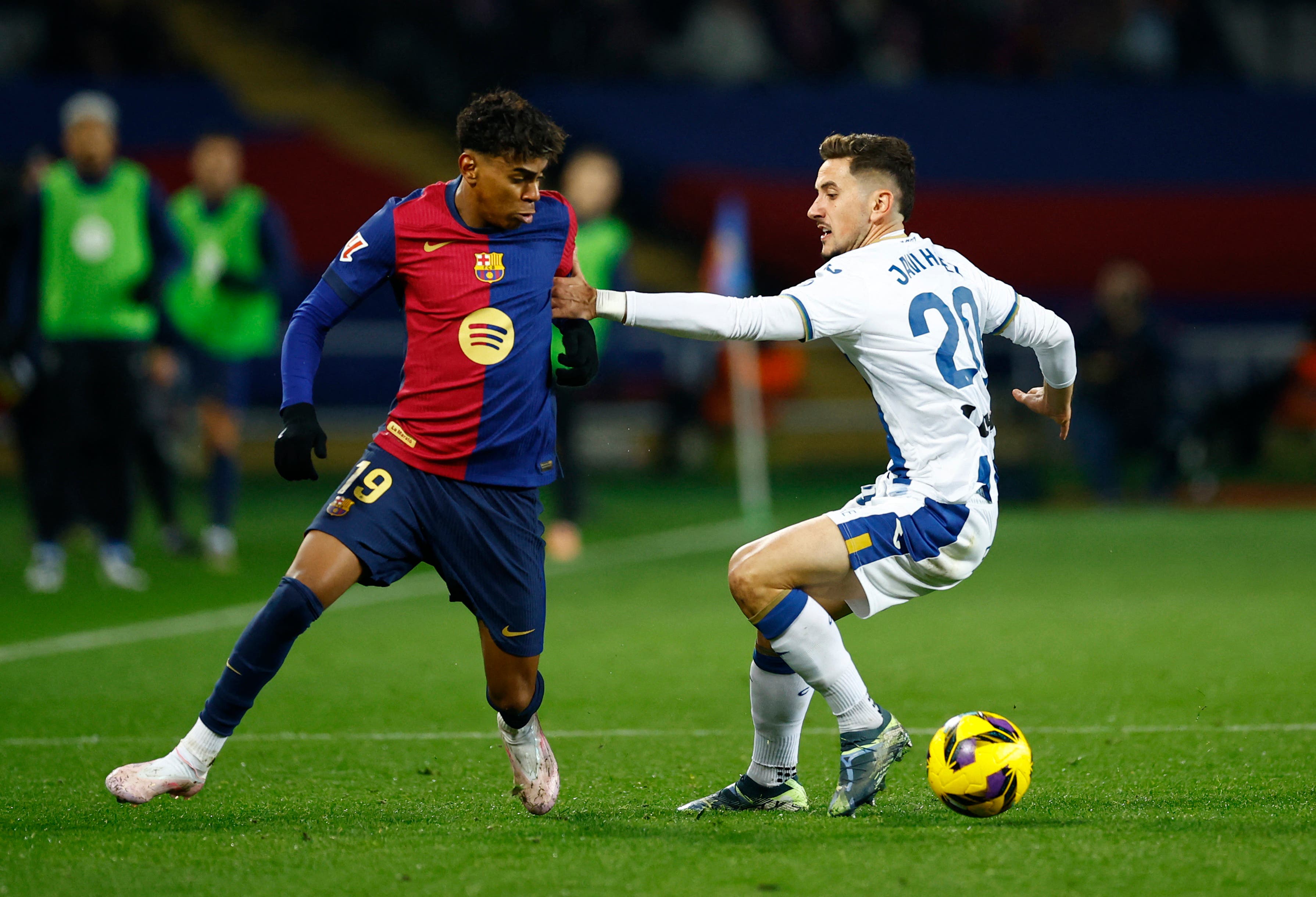 Soccer Football - LaLiga - FC Barcelona v Leganes - Estadi Olimpic Lluis Companys, Barcelona, Spain - December 15, 2024 FC Barcelona's Lamine Yamal in action with Leganes' Javi Hernandez REUTERS/Albert Gea