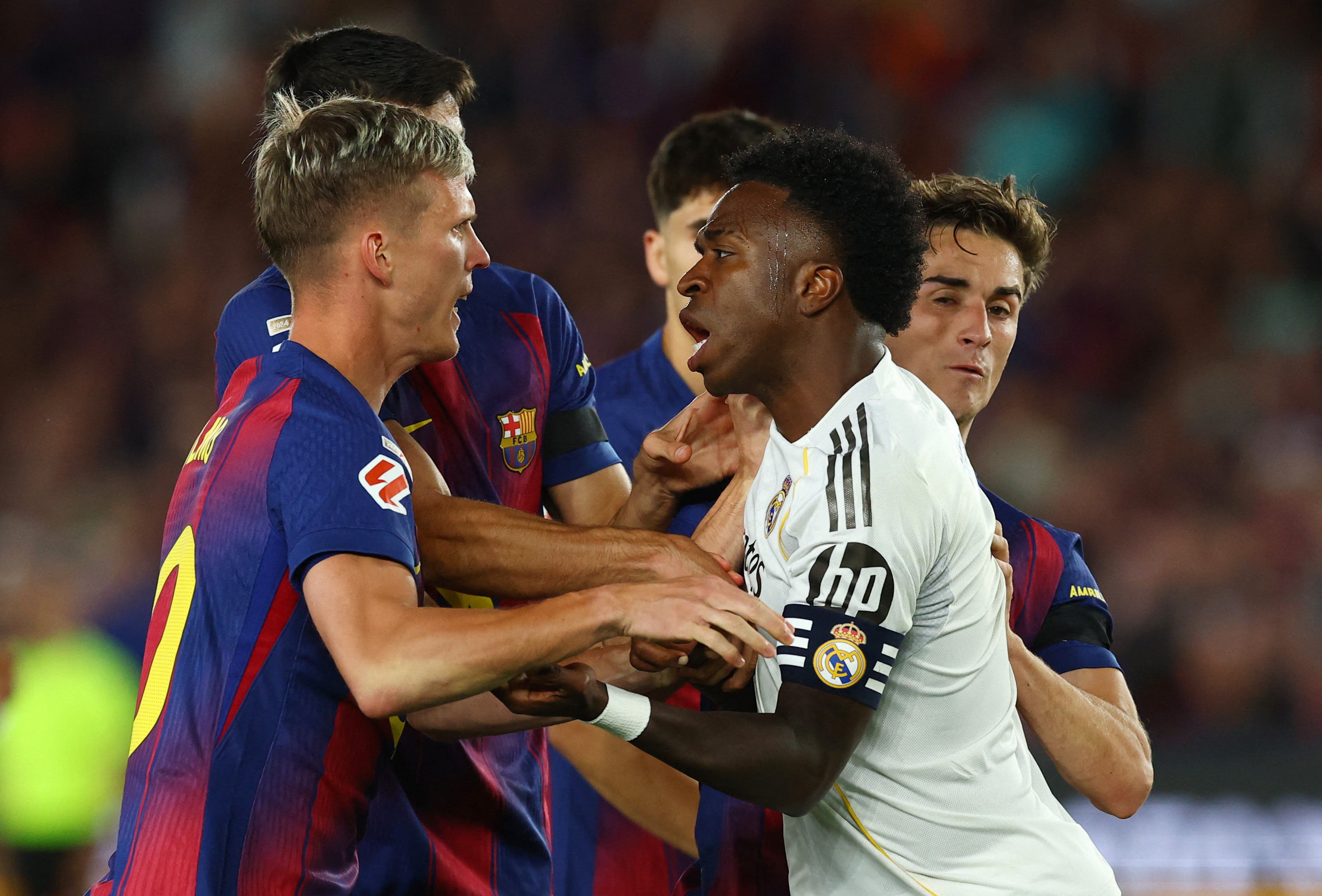 Soccer Football - LaLiga - FC Barcelona v Real Madrid - Spotify Camp Nou, Barcelona, Spain - May 10, 2026 Real Madrid's Vinicius Junior clashes with FC Barcelona's Dani Olmo REUTERS/Albert Gea