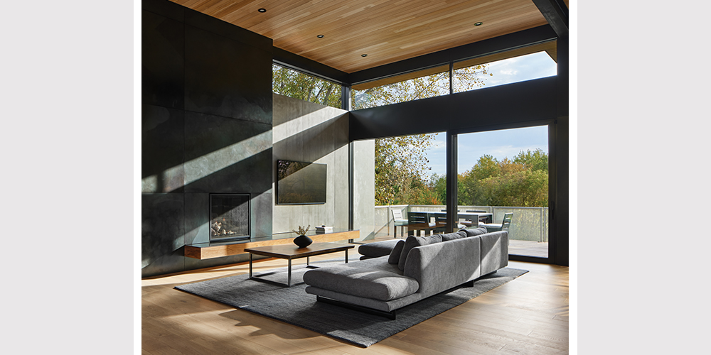 Interior of modern renovated home with large windows and massive lift & slide doors