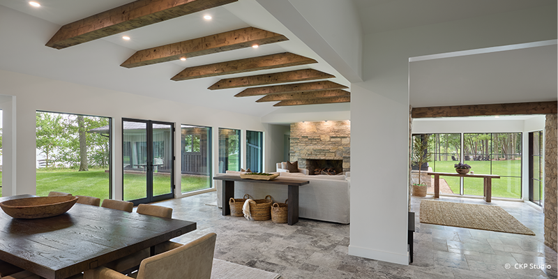 foyer after renovations with expansive windows and door