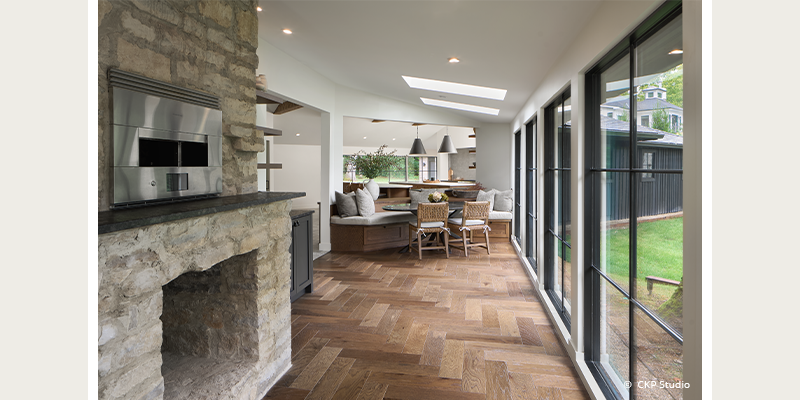 fireplace in an open lay facing expanded window.