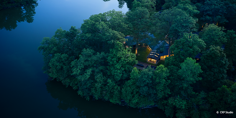 newly renovated home on a peninsula and nestled in the woods