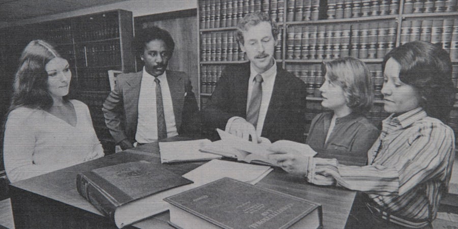 Stand up meeting with 1970's business professionals