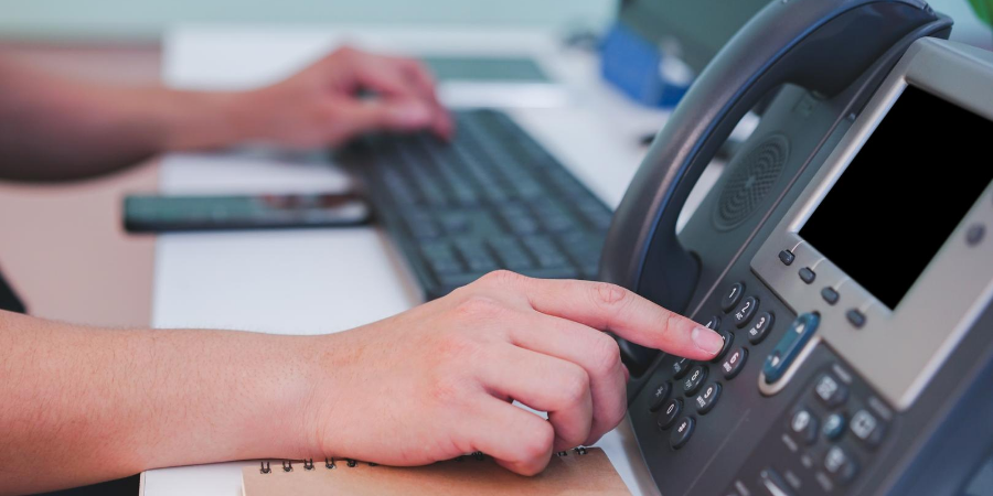 Hand dialing multiline business office phone.