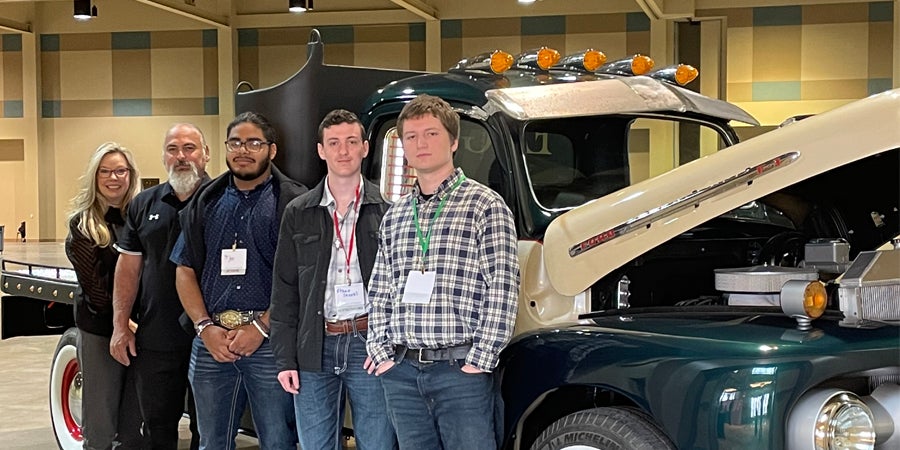 Woodville ISD students and teachers with the 1951 Ford truck they restored in their automotive class.