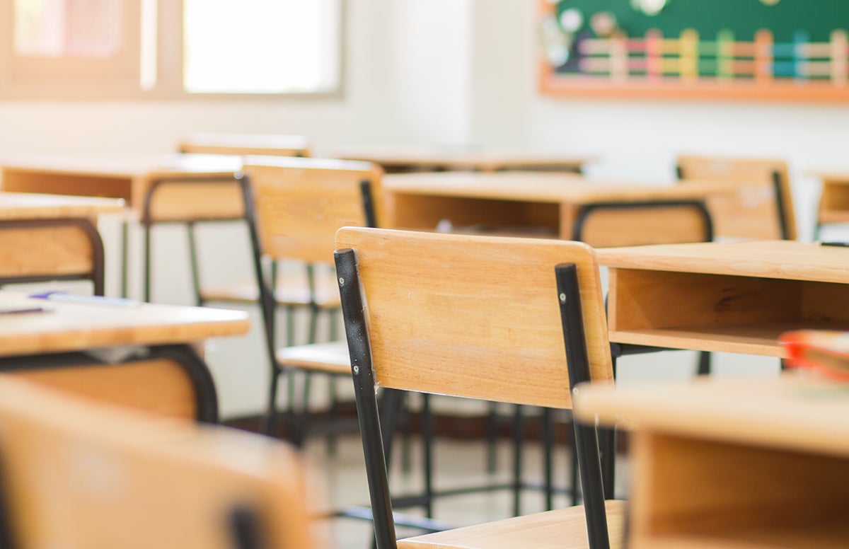 Empty desks in a classroom.