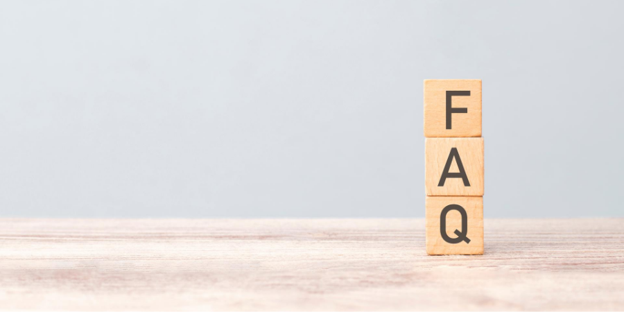 FAQ letter tiles stacked on a wooden surface