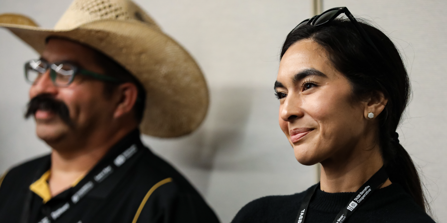 SLI attendees sitting next to each other and smiling