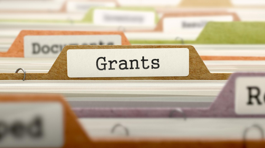 File folder in file drawer, image focused on the folder labeled Grants