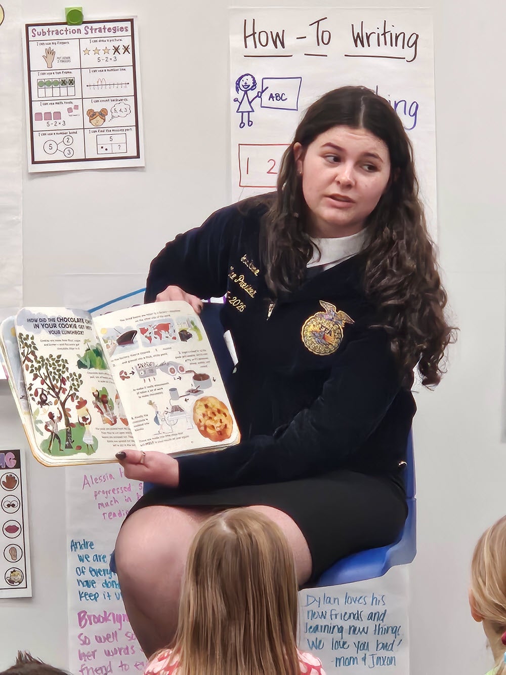 Ava Stone, Friendswood High School senior reads about agriculture to elementary students