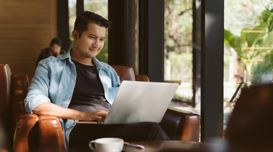 Man on a laptop in a coffee shop