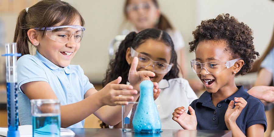 Three girls with foaming science experience