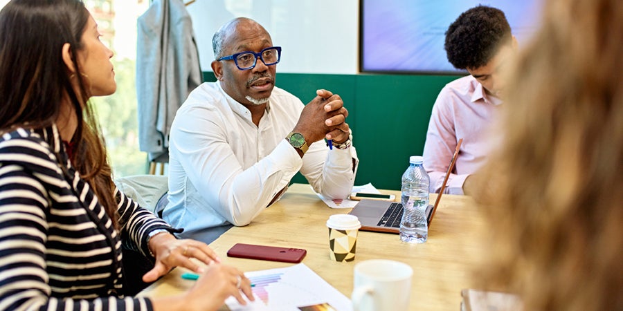 photo of a man speaking to a group
