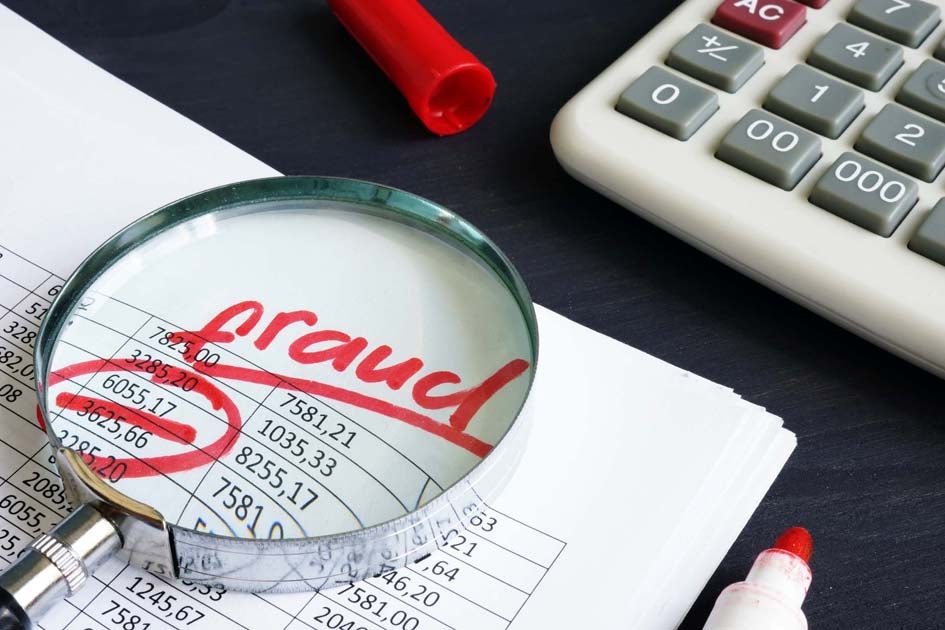 Financial document with fraud written on it