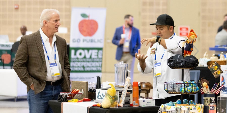 Exhibitors interacting in the txEDCON Exhibit Hall.