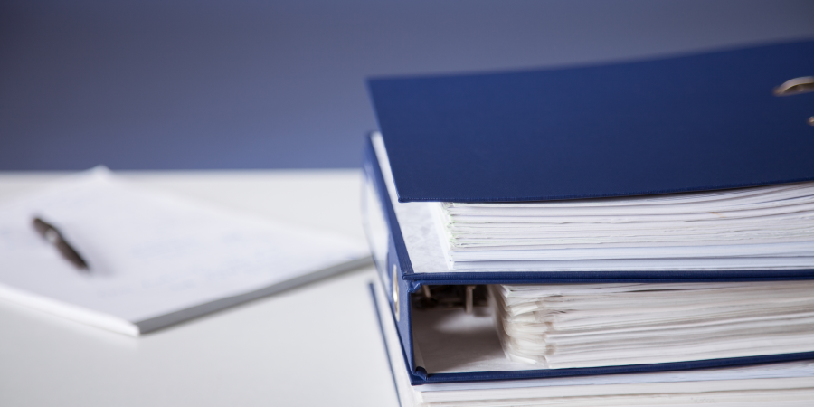 A stack of blue binders.