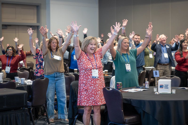 Attendees participate in keynote activity
