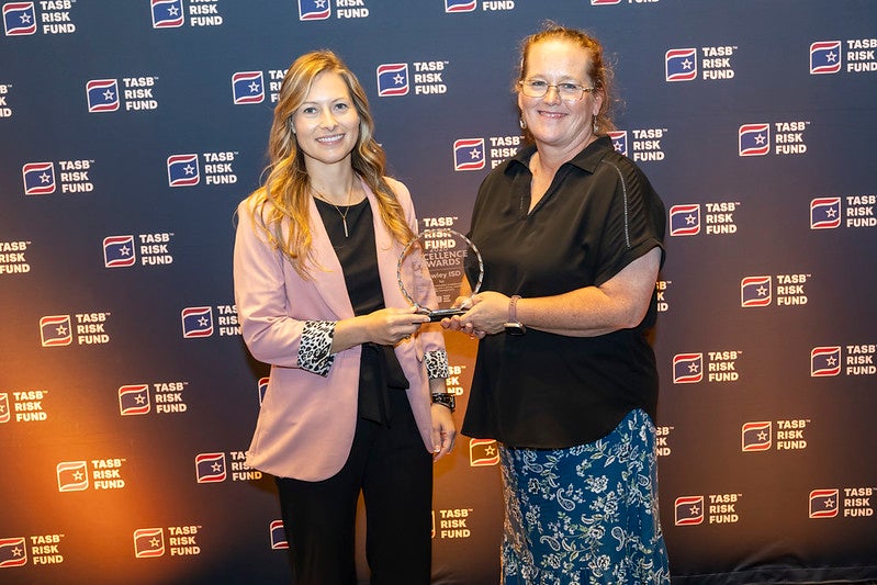 Miranda Cox and Cassidy McBrayer accept Hawley ISD's Fund Excellence Award