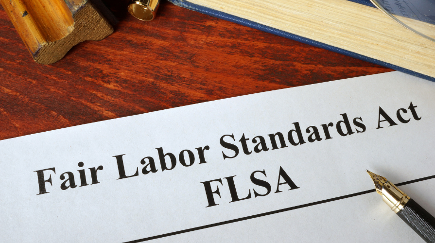 Fair Labor Standards Act document and pen on desk