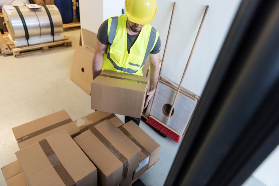 Employee lifting boxes