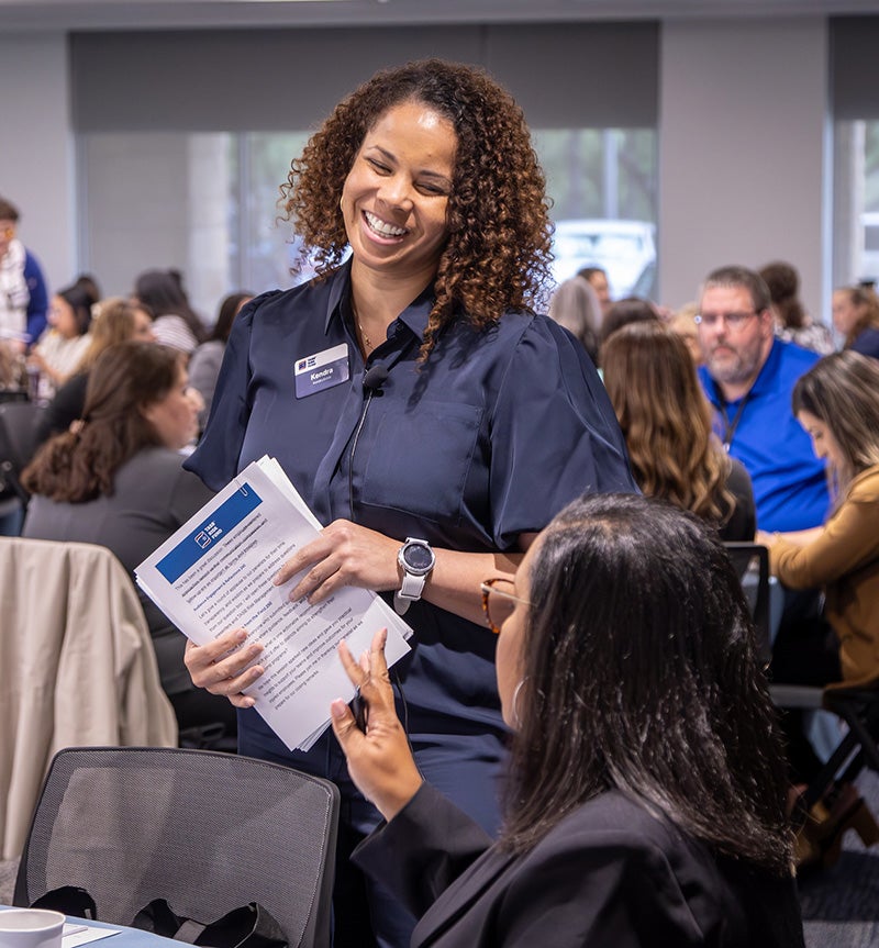 Kendra Estes interacts with members at a Fund event last year. She oversees the Risk Management 101 Training Program.