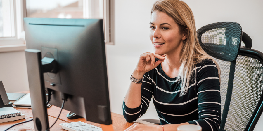 Woman working and looking at monitor