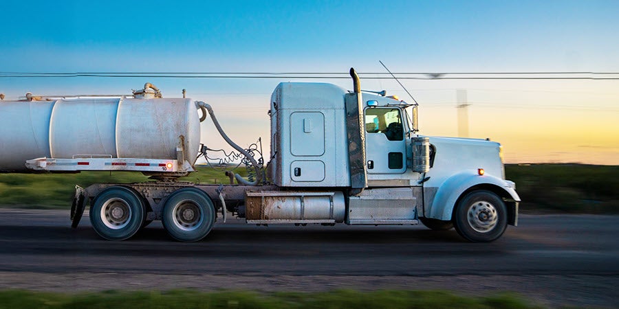 White semi truck transporting propane.