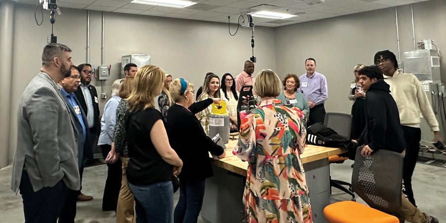 During the tour of Fort Bend ISD’s Reese Career & Technical Center, members of the LTASB Class of 2024 learn more about the school’s HVAC-RT (heating, ventilation, air conditioning, and refrigeration technology) program while observing some tools that are used during training.