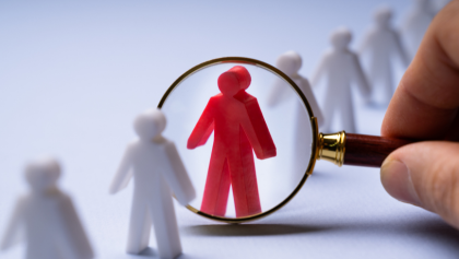 Person figure with magnified glass on them 