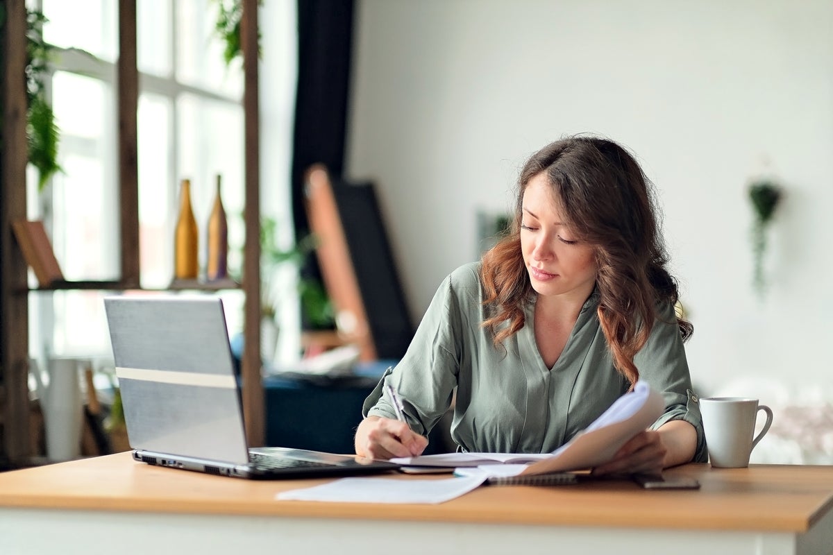 Woman working at a desk.