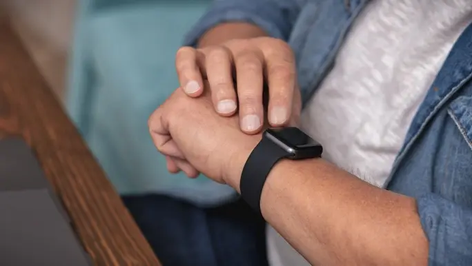 Man checking his heart rate on his smartwatch