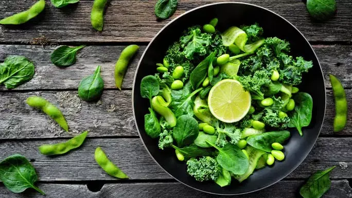 A low FODMAP vegetable salad of kale, edamame and spinach